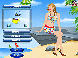 Vestir a Gloria en la playa